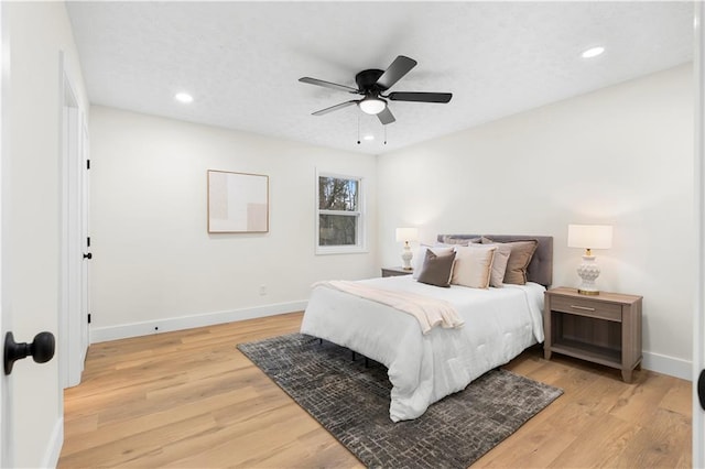 bedroom featuring ceiling fan and light hardwood / wood-style floors