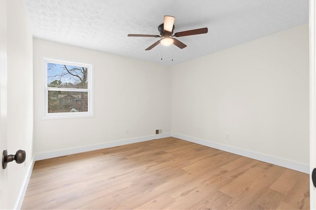 unfurnished room featuring a textured ceiling, ceiling fan, and light hardwood / wood-style flooring