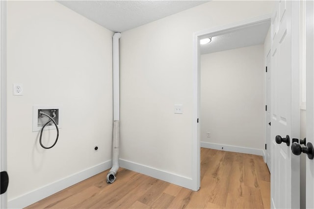 laundry room with washer hookup, hardwood / wood-style floors, a textured ceiling, and hookup for an electric dryer