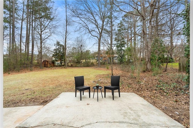 view of patio with a storage unit