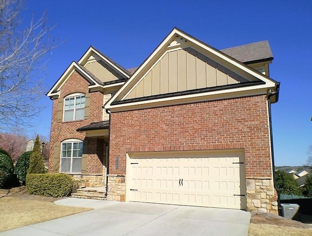 view of front of property featuring board and batten siding, concrete driveway, and stone siding