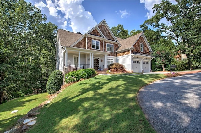 16 Cambridge Way, Cartersville, GA 30121 - view of front of home with driveway, a front yard, a porch, and roof with shingles
