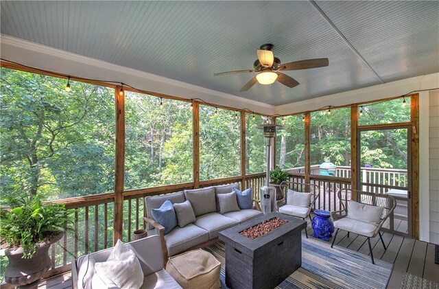 16 Cambridge Way, Cartersville, GA 30121 - sunroom featuring a ceiling fan and an outdoor living space with a fire pit