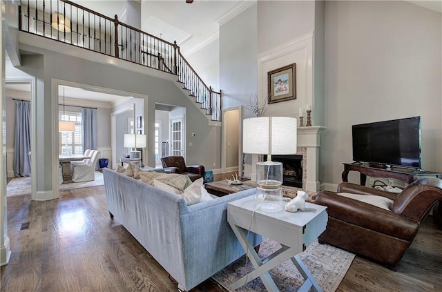 16 Cambridge Way, Cartersville, GA 30121 - living area featuring wood finished floors, a high ceiling, a fireplace, and crown molding
