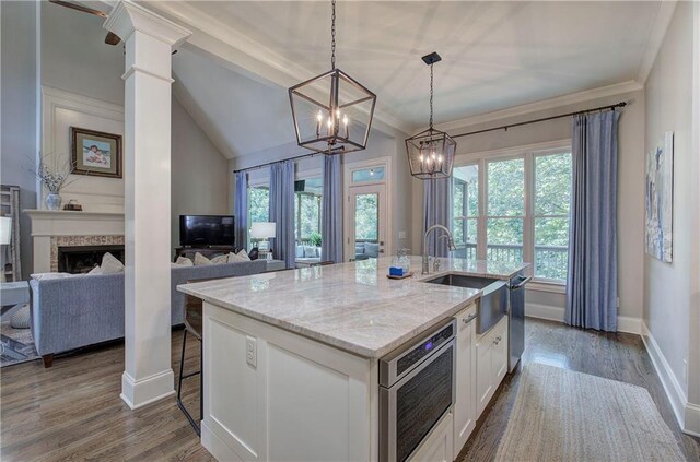 16 Cambridge Way, Cartersville, GA 30121 - kitchen with dark wood-style floors, white cabinetry, light stone counters, a chandelier, and pendant lighting