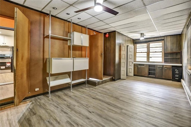 3137 Ardley Rd SW, Atlanta, GA 30311 - interior space with a ceiling fan, a paneled ceiling, light wood-style floors, and wooden walls