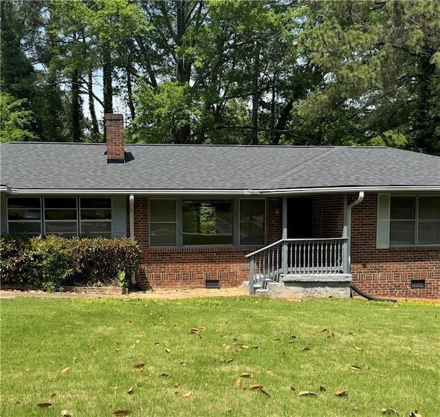 single story home with brick siding and a front lawn