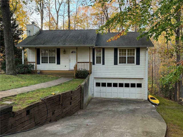 view of front of home featuring a front lawn, a porch, and a garage