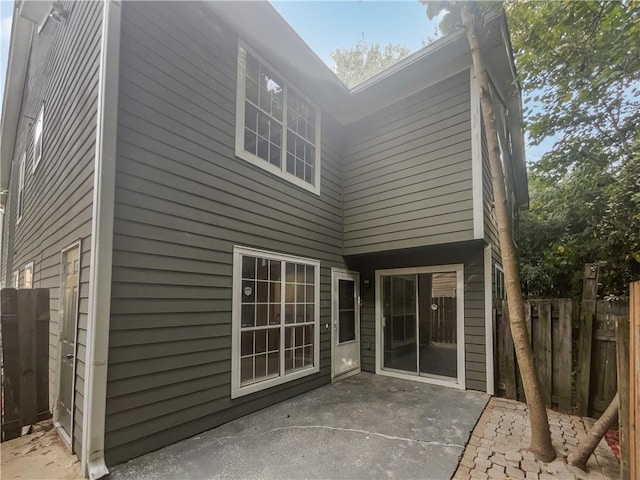 rear view of property featuring a patio area