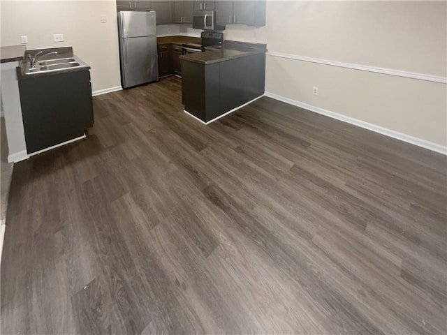 1097 Rock Creek Ln, Norcross, GA 30093 - kitchen with sink, dark hardwood / wood-style floors, stainless steel appliances, and kitchen peninsula
