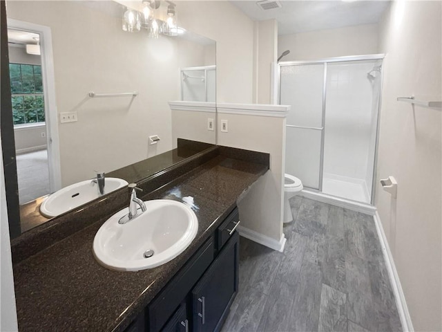 1097 Rock Creek Ln, Norcross, GA 30093 - bathroom featuring hardwood / wood-style floors, vanity, toilet, and walk in shower