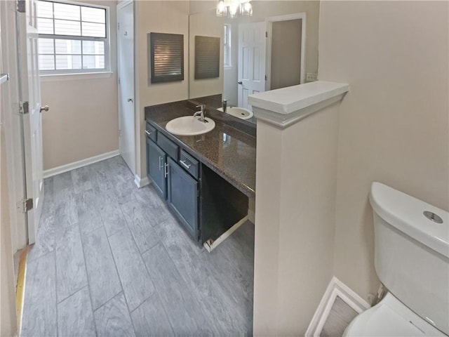 1097 Rock Creek Ln, Norcross, GA 30093 - bathroom featuring vanity, hardwood / wood-style flooring, and toilet