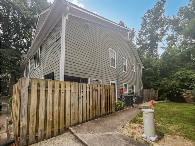 1097 Rock Creek Ln, Norcross, GA 30093 - view of side of property with central AC and a yard