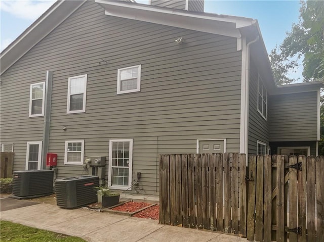 1097 Rock Creek Ln, Norcross, GA 30093 - rear view of property with central AC