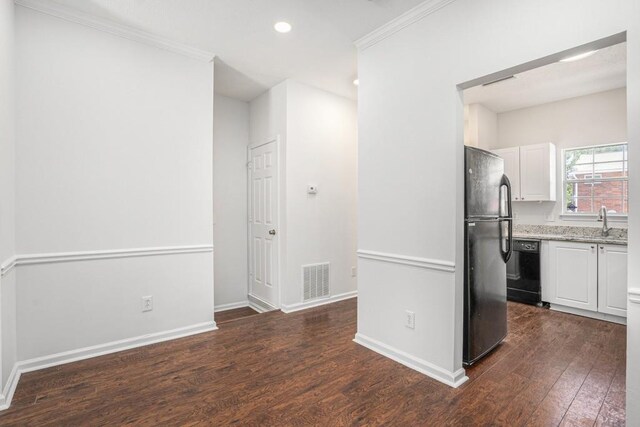 277 Ralph David Abernathy Blvd SW, Atlanta, GA 30312 - kitchen featuring black appliances, dark wood finished floors, crown molding, white cabinetry, and a sink