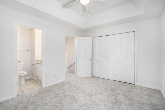 277 Ralph David Abernathy Blvd SW, Atlanta, GA 30312 - unfurnished bedroom featuring carpet flooring, a closet, a raised ceiling, baseboards, and ensuite bathroom
