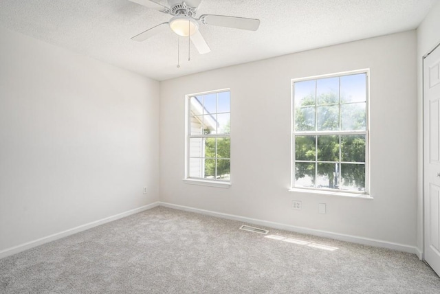 277 Ralph David Abernathy Blvd SW, Atlanta, GA 30312 - carpeted spare room with plenty of natural light, baseboards, a textured ceiling, and ceiling fan