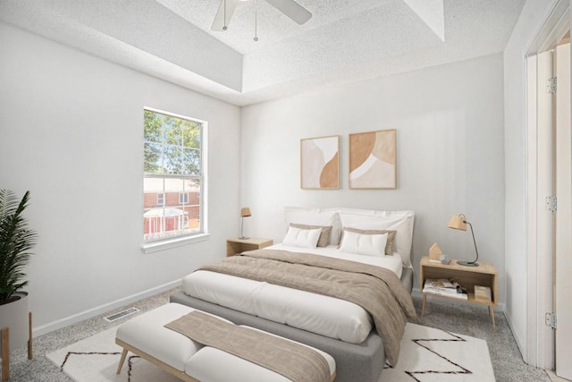 277 Ralph David Abernathy Blvd SW, Atlanta, GA 30312 - bedroom with carpet floors, a textured ceiling, baseboards, a tray ceiling, and ceiling fan