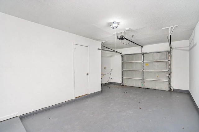 277 Ralph David Abernathy Blvd SW, Atlanta, GA 30312 - garage featuring baseboards and a garage door opener
