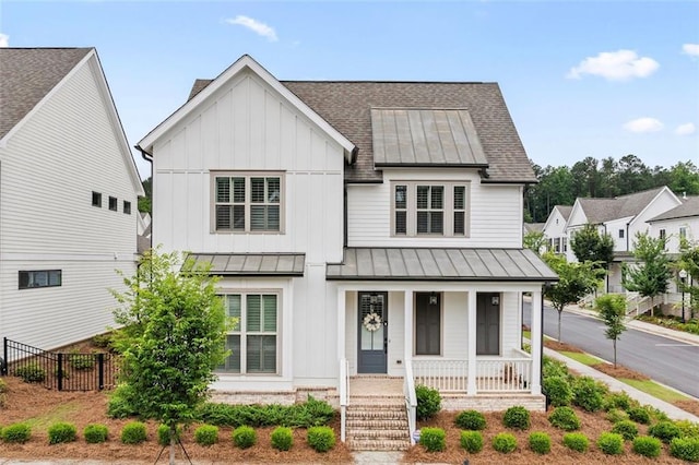 993 Harvest Park Ln, Suwanee, GA 30024 - modern farmhouse with a standing seam roof, a shingled roof, covered porch, board and batten siding, and metal roof