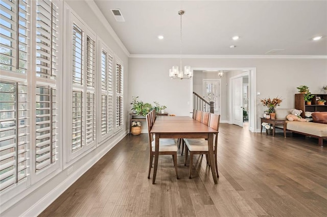 993 Harvest Park Ln, Suwanee, GA 30024 - dining room with a chandelier, wood finished floors, recessed lighting, baseboards, and ornamental molding