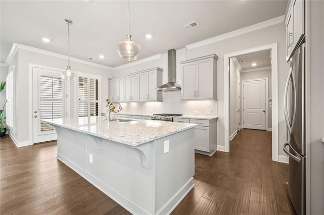 993 Harvest Park Ln, Suwanee, GA 30024 - kitchen featuring wall chimney range hood, a sink, ornamental molding, dark wood-style flooring, and light stone countertops