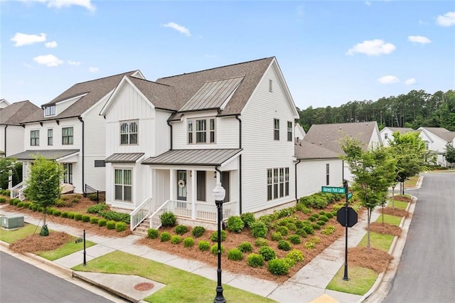 993 Harvest Park Ln, Suwanee, GA 30024 - view of front of house featuring a porch, a standing seam roof, board and batten siding, a residential view, and a shingled roof