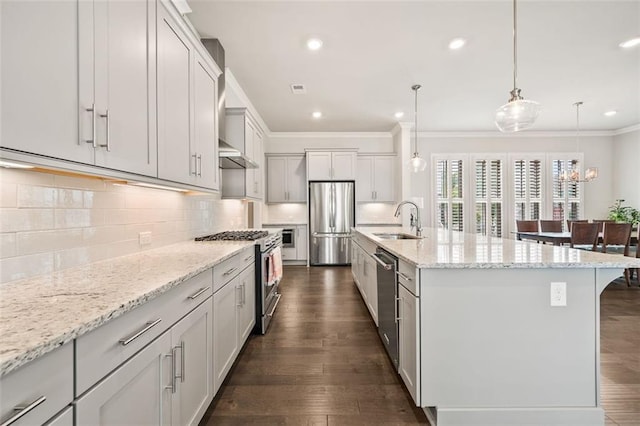 993 Harvest Park Ln, Suwanee, GA 30024 - kitchen with appliances with stainless steel finishes, a sink, ornamental molding, backsplash, and dark wood finished floors
