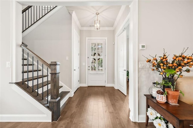 993 Harvest Park Ln, Suwanee, GA 30024 - foyer featuring wood finished floors, stairs, baseboards, and ornamental molding