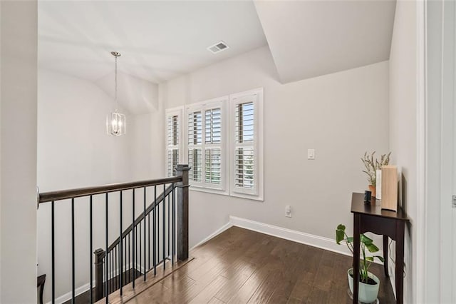 993 Harvest Park Ln, Suwanee, GA 30024 - corridor featuring an upstairs landing, baseboards, dark wood-style floors, a chandelier, and vaulted ceiling