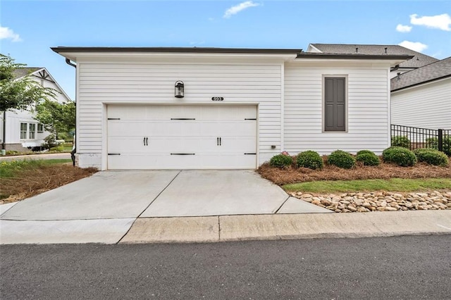 993 Harvest Park Ln, Suwanee, GA 30024 - view of front of house featuring driveway and an attached garage