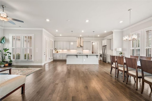 993 Harvest Park Ln, Suwanee, GA 30024 - living area featuring healthy amount of natural light, ceiling fan, dark wood-style floors, recessed lighting, and a chandelier