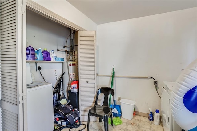 clothes washing area featuring electric dryer hookup, water heater, and separate washer and dryer