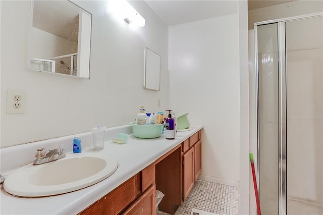 bathroom featuring an enclosed shower, double sink, tile floors, and large vanity