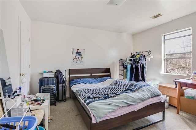 bedroom featuring light colored carpet