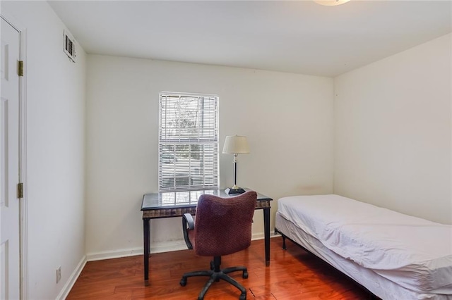 bedroom featuring dark hardwood / wood-style floors