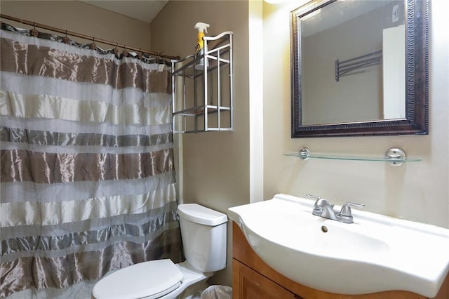 bathroom featuring toilet and oversized vanity