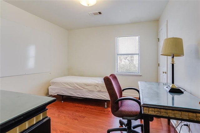 bedroom featuring hardwood / wood-style flooring