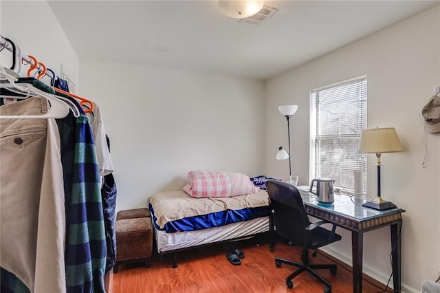 bedroom featuring dark wood-type flooring