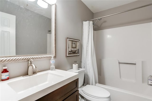 full bathroom with vanity, shower / tub combo with curtain, and toilet