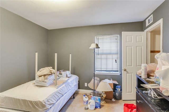 bedroom with light colored carpet