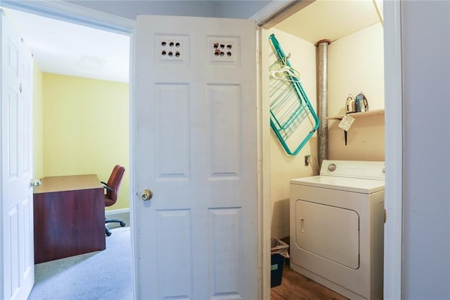 clothes washing area featuring washer / clothes dryer and light carpet