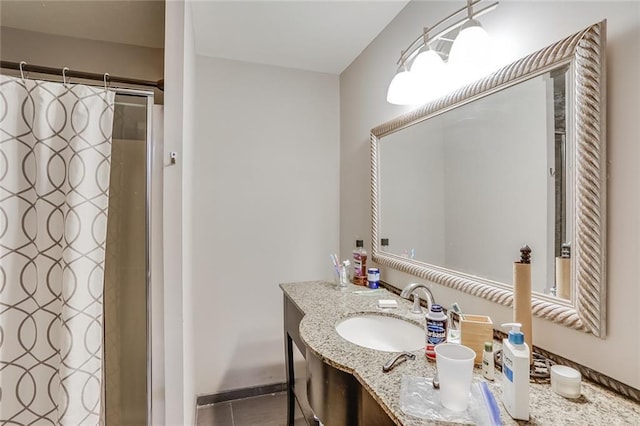 bathroom with oversized vanity and tile flooring