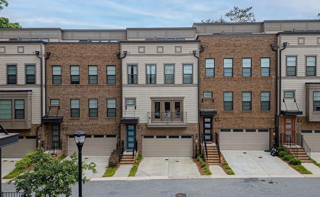 townhome / multi-family property featuring a garage