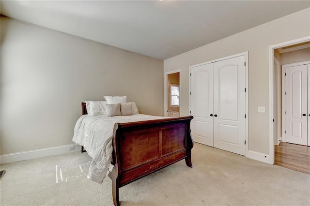 carpeted bedroom featuring a closet