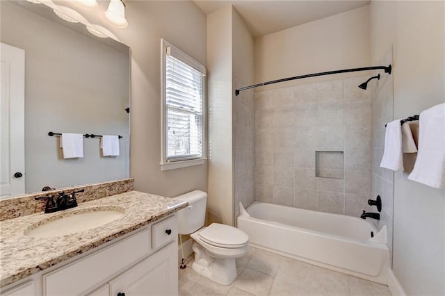 full bathroom with toilet, vanity, tile patterned floors, and tiled shower / bath