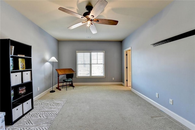 living area with ceiling fan and light colored carpet