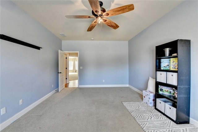 unfurnished bedroom featuring ceiling fan and light colored carpet