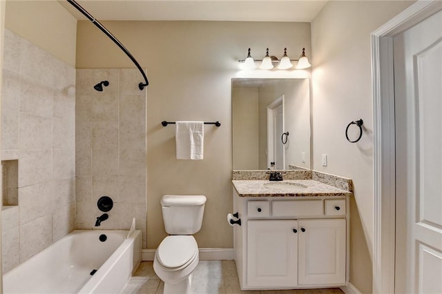 full bathroom featuring toilet, vanity, tile patterned flooring, and tiled shower / bath