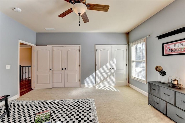 carpeted bedroom featuring ceiling fan